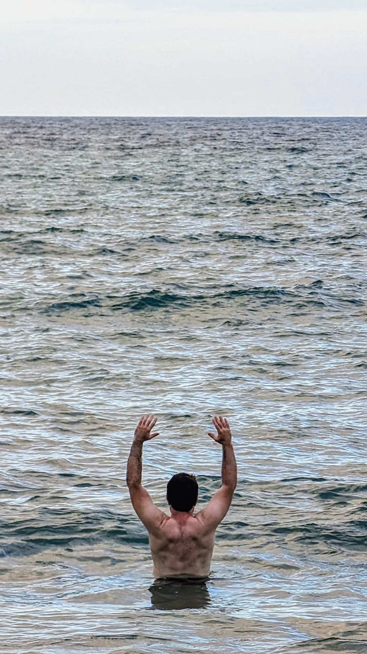 Stretching in the ocean at Montezuma.