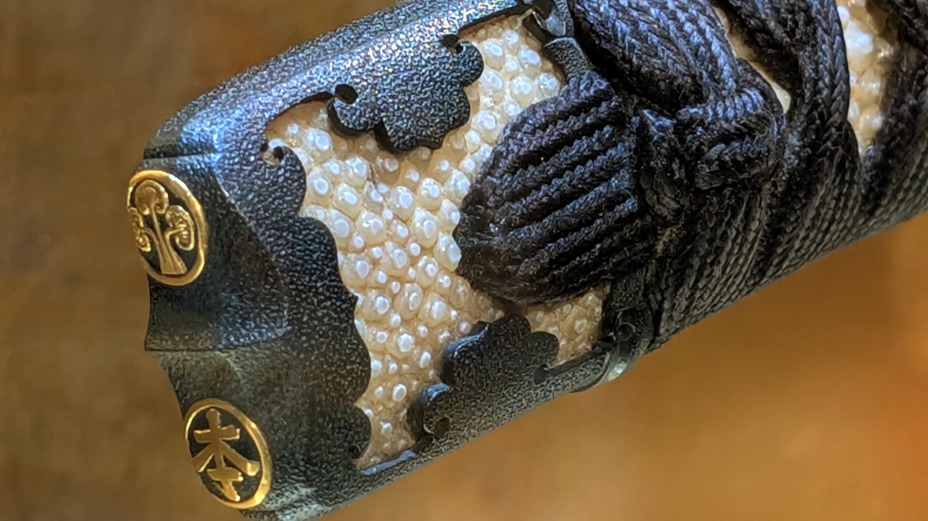 A close-up of the sword’s ray-skin grip, its pebbled texture helping maintain a secure hold.